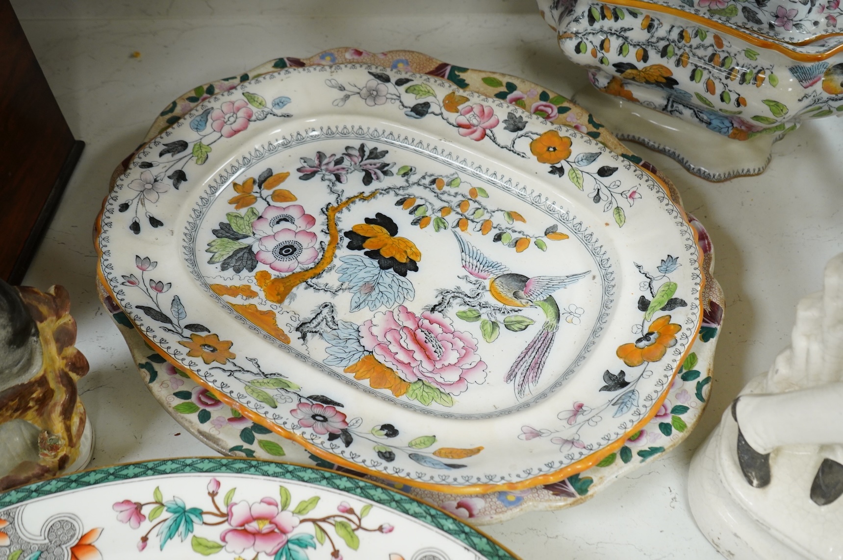 Three 19th century Staffordshire figures, including General Garibaldi, a Staffordshire pottery soup tureen and four serving plates, largest 48cm wide